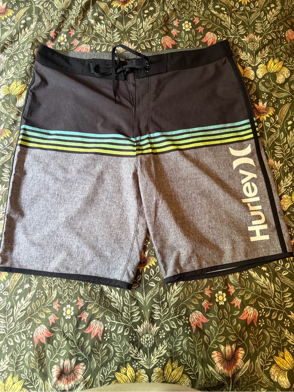 Hurley Men’s Gray & Black board shorts.